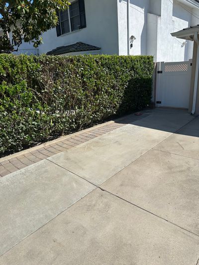 The same Downey driveway cleared, with only a faint mark left where the concrete sat